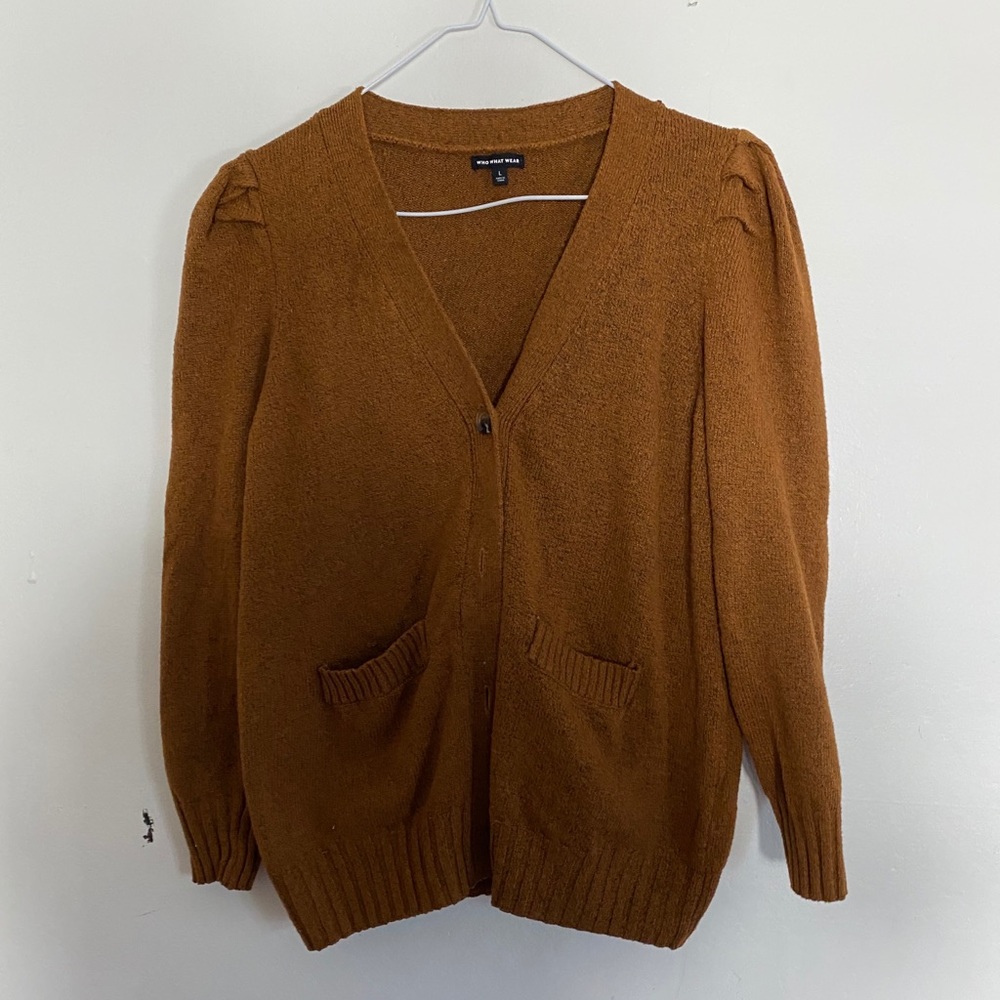 Who what were large brown cardigan